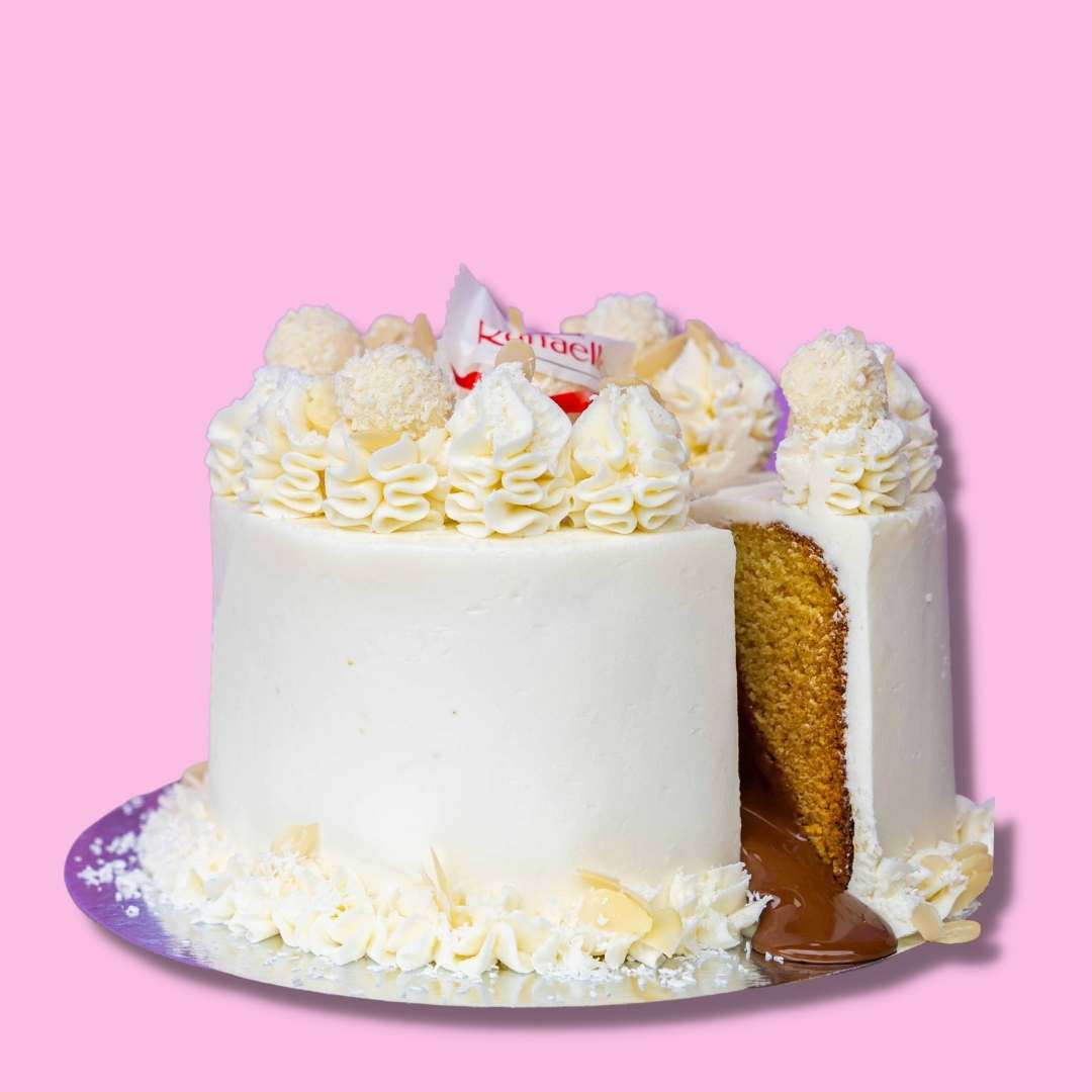 Coconut Cake with oozing Nutella - Perfect Birthday Cake with coco flakes